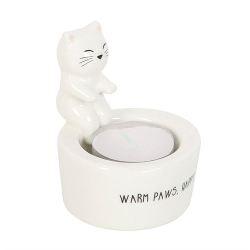 Cat-shaped candle holder with a small candle inside on a white background
