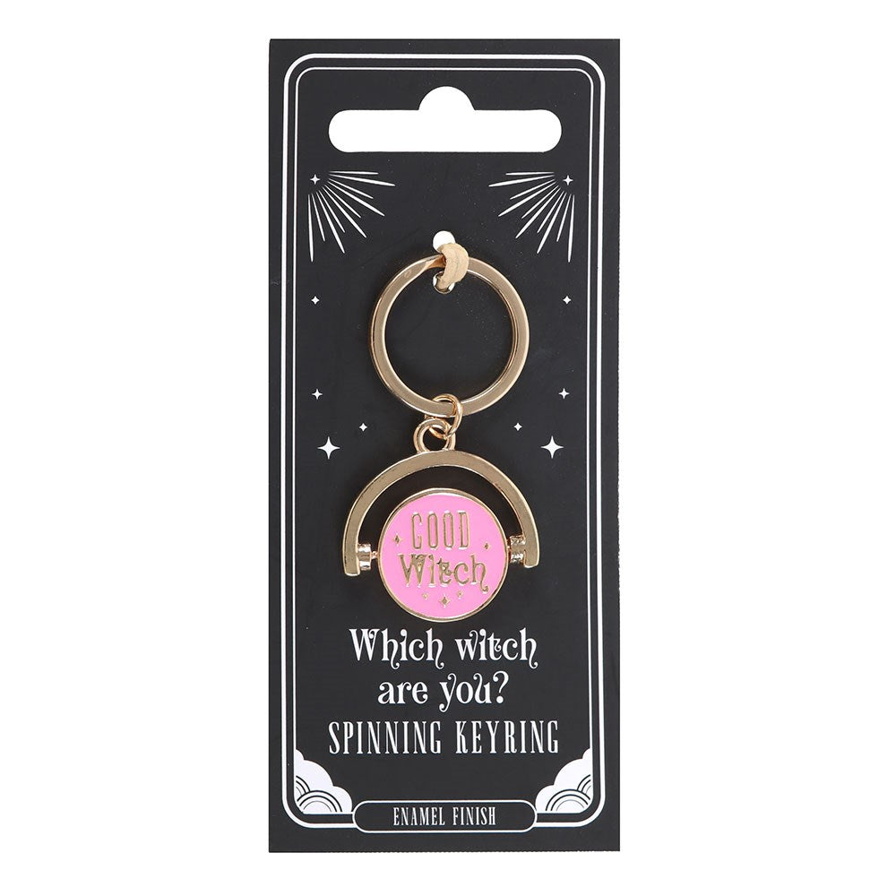 Keyring with pink center and gold frame on a black card packaging