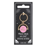 Keyring with pink center and gold frame on a black card packaging