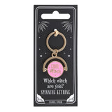 Keyring with pink center and gold frame on a black card packaging