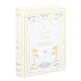 Packaging of 'Good Vibes' book with decorative elements on a white background