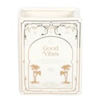 Candle with 'Good Vibes' text and palm tree designs on a white background