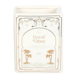 Candle with 'Good Vibes' text and palm tree designs on a white background