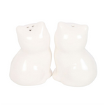Two white ceramic cat-shaped salt and pepper shakers on a white background
