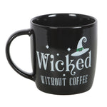 Black mug with 'Wicked Without Coffee' text and witch hat design on a white background