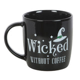 Black mug with 'Wicked Without Coffee' text and witch hat design on a white background