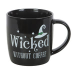 Black mug with 'Wicked Without Coffee' text and witch hat design on a white background