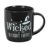 Black mug with 'Wicked Without Coffee' text and witch hat design on a white background